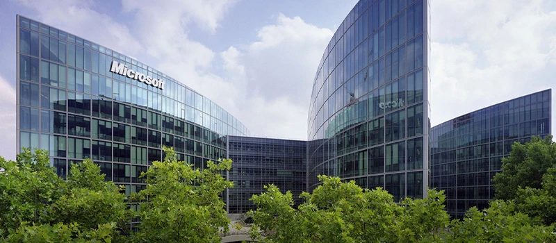 Modern glass office campus representing global business connectivity and economic growth