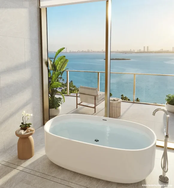 Spa-inspired bathroom with freestanding soaking tub overlooking Biscayne Bay at Kempinski Residences Miami Design District