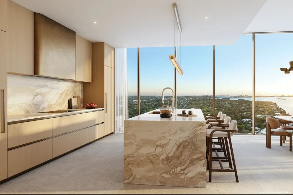 Luxury kitchen at Kempinski Residences Miami Design District with marble island, warm wood cabinetry, and bay views