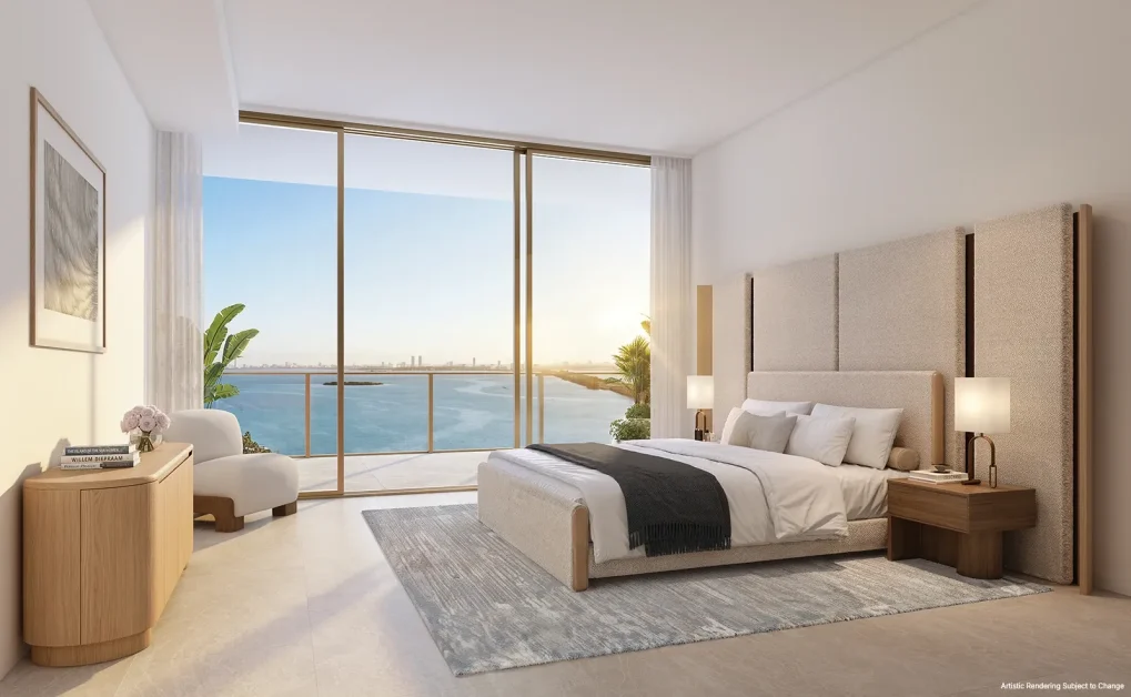 Kempinski Residences Miami Design District bedroom with floor-to-ceiling windows, balcony, and Biscayne Bay view