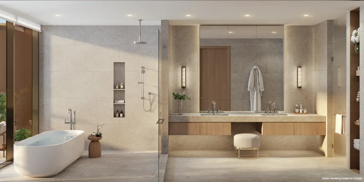 Primary bathroom at Kempinski Residences Miami Design District with soaking tub, glass shower, double vanity, and stone finishes