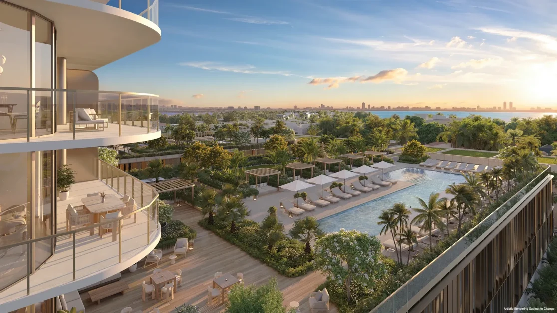 South pool area at Kempinski Residences Miami Design District with terraces, cabanas, tropical landscaping, and Biscayne Bay views