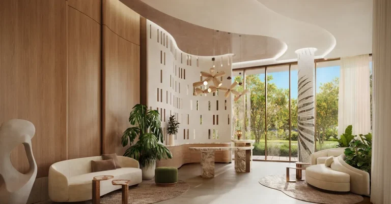Elegant curved lobby featuring warm wood panels, sculptural furniture, organic pendant lighting, and floor-to-ceiling windows overlooking lush greenery.