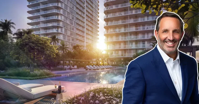 A smiling real estate professional in a navy blazer poses before a luxury high-rise development featuring a resort-style pool surrounded by tropical landscap...