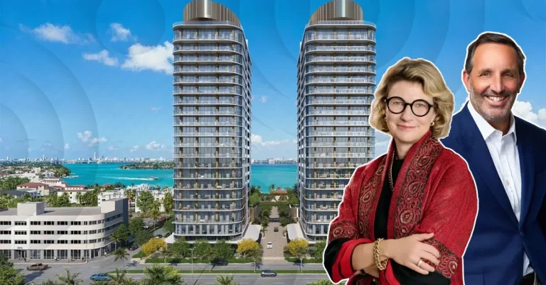 Two real estate professionals pose before a luxury Miami Beach twin-tower waterfront condominium development with stunning Biscayne Bay views.