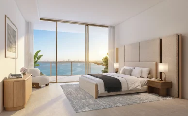 Kempinski Residences Miami Design District bedroom with floor-to-ceiling windows, balcony, and Biscayne Bay view